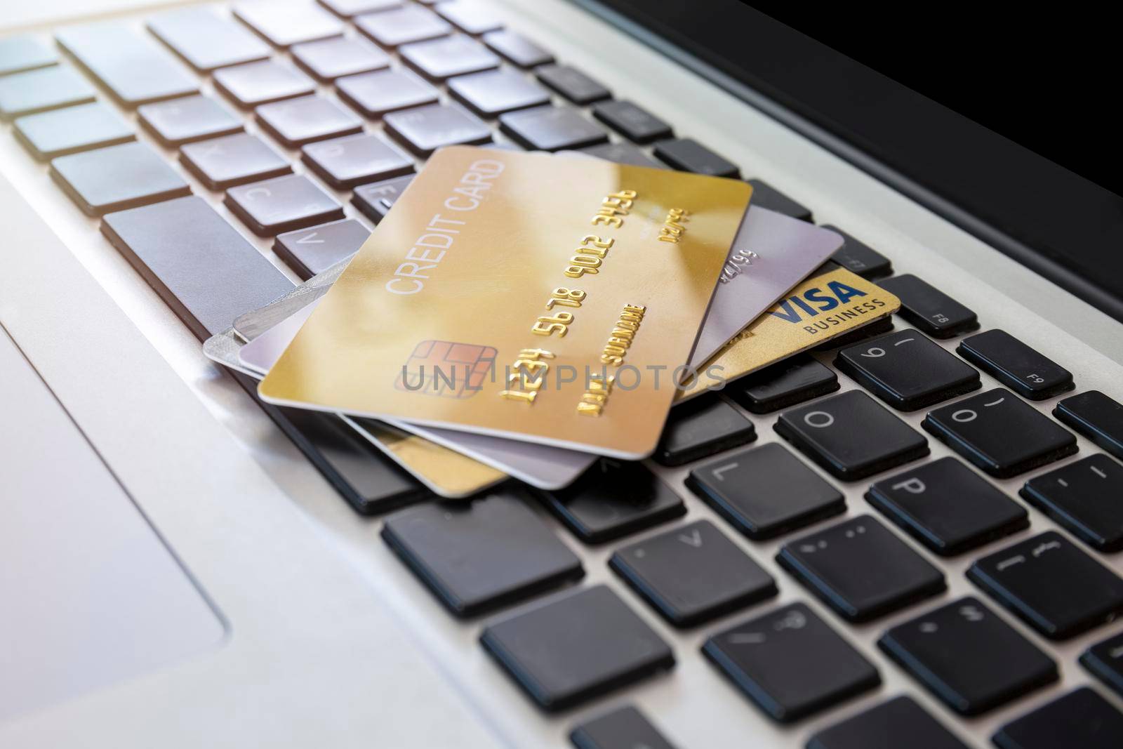 Close up Credit card on laptop of business workplan. many credit card on laptop keyboard of online shopping payment. Credit card payment for purchases from online stores and online shopping,