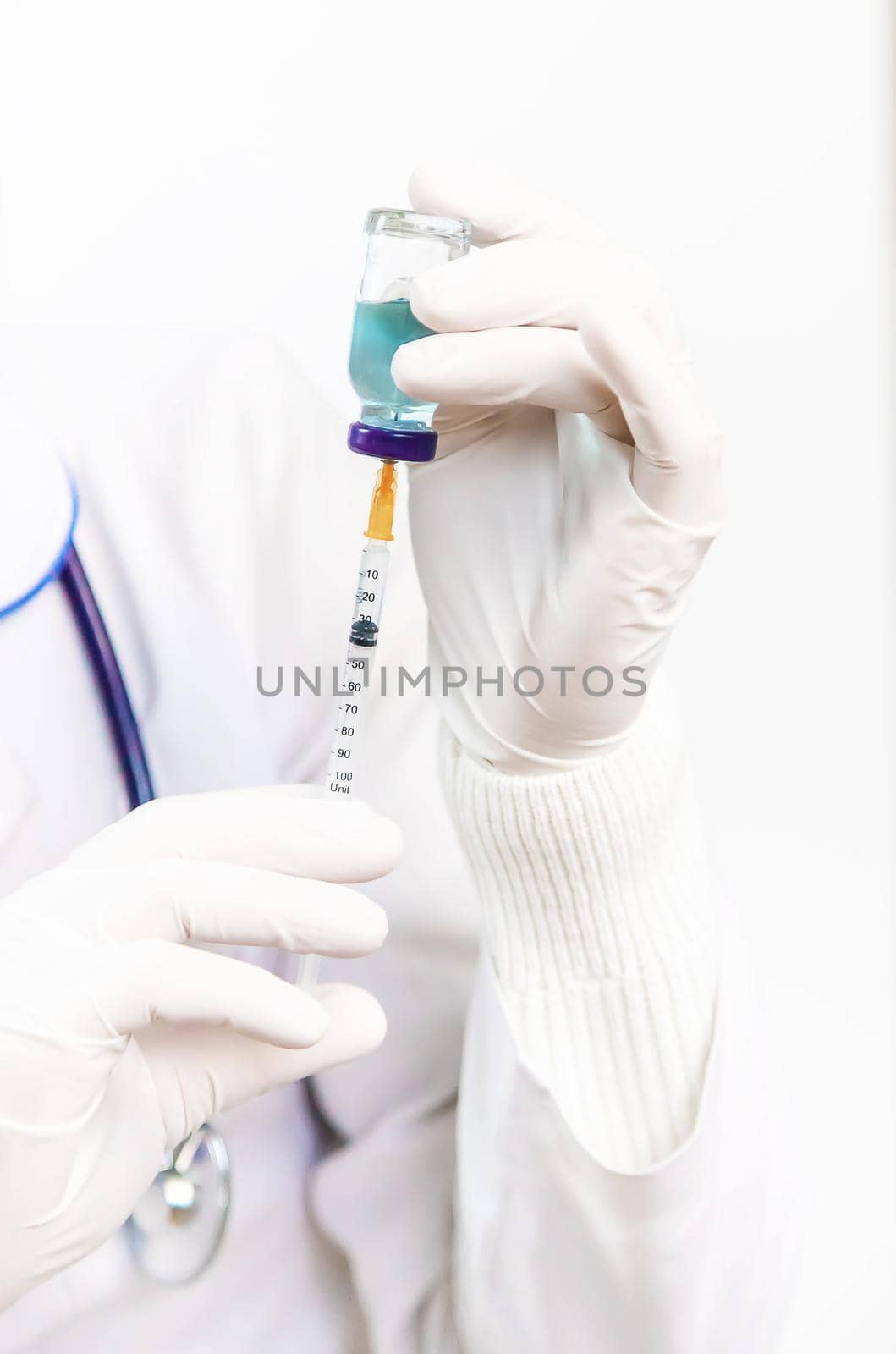 Doctor filling syringe with medication, closeup. Vaccination and immunization. Selective focus. Vaccine.