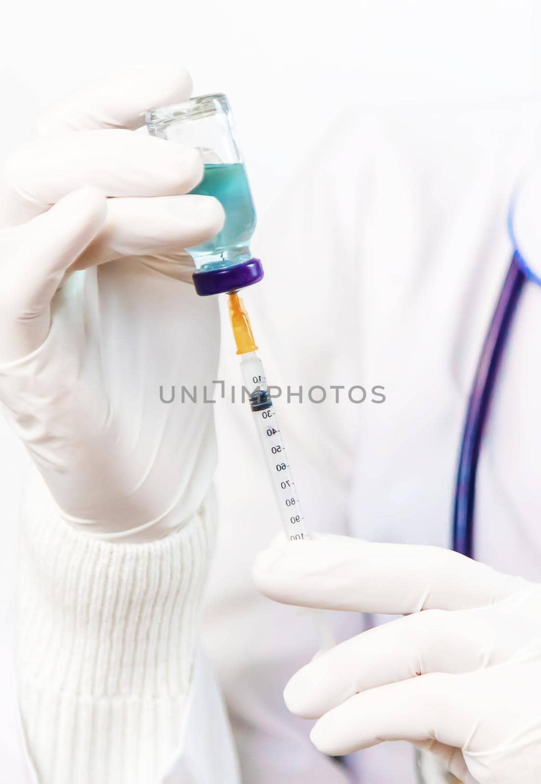 Doctor filling syringe with medication, closeup. Vaccination and immunization. Selective focus. Vaccine.