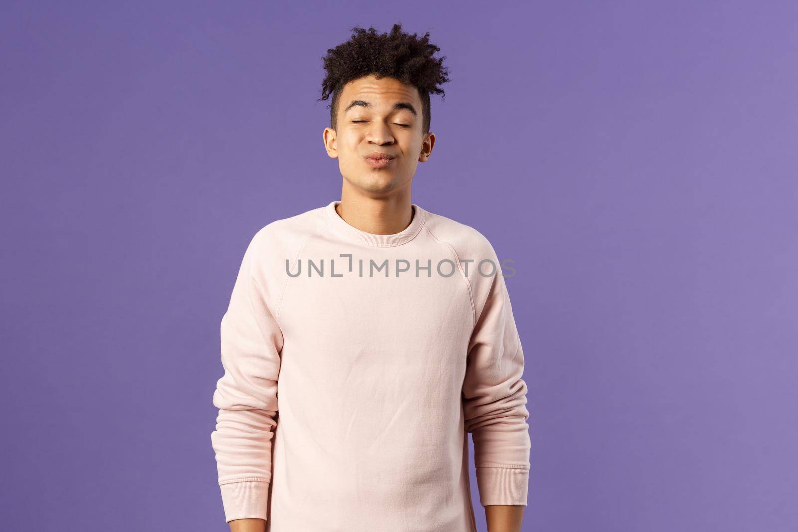 Portrait of cute and silly, young hispanic trying to kiss girl after date for the first time, leaning with folded lips and closed eyes towards her, making funny smile, standing purple background by Benzoix