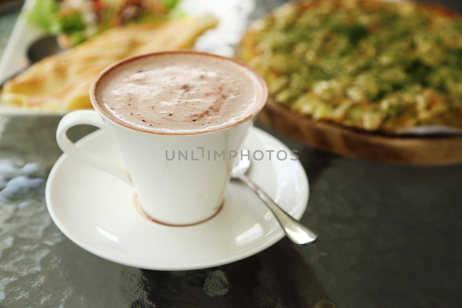 cup of hot chocolate with Pizza Japanese style in a cafe