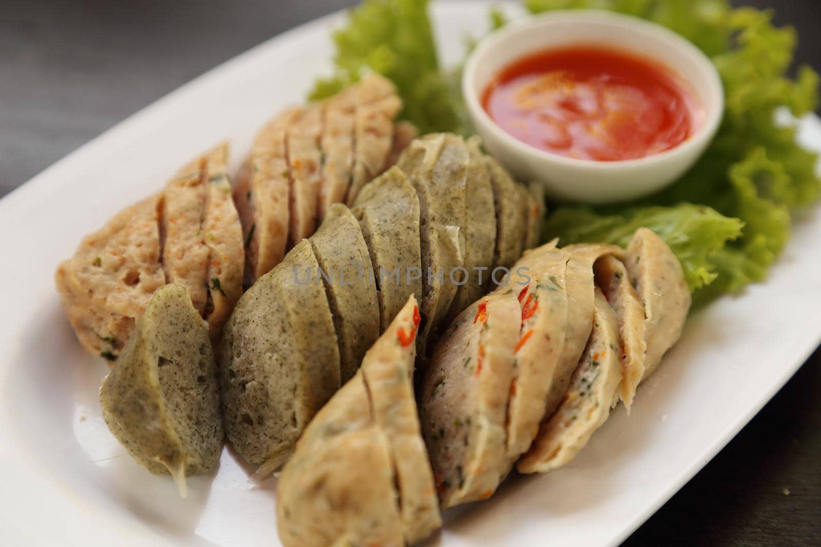 ''Mooyor'' or Vietnamese sausage pork with sauce on a plate