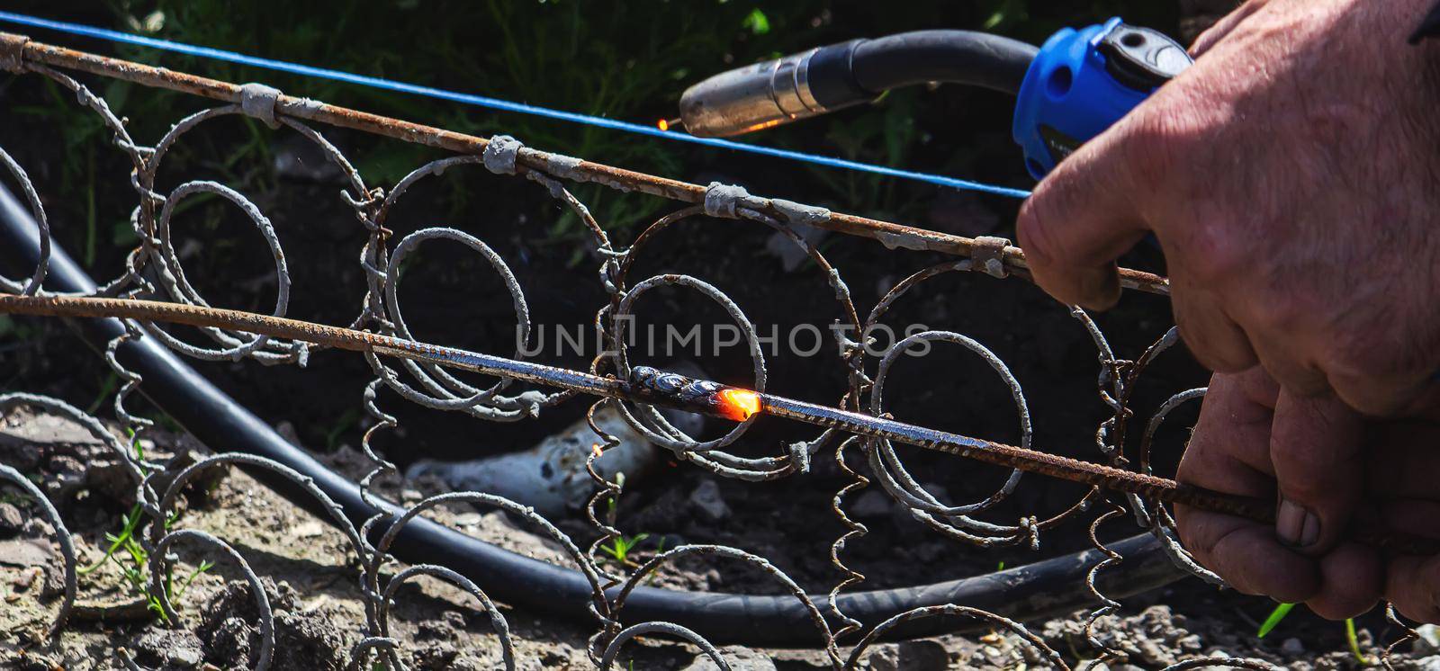 Welder Welding Steel Bars Rebar, Selective Focus