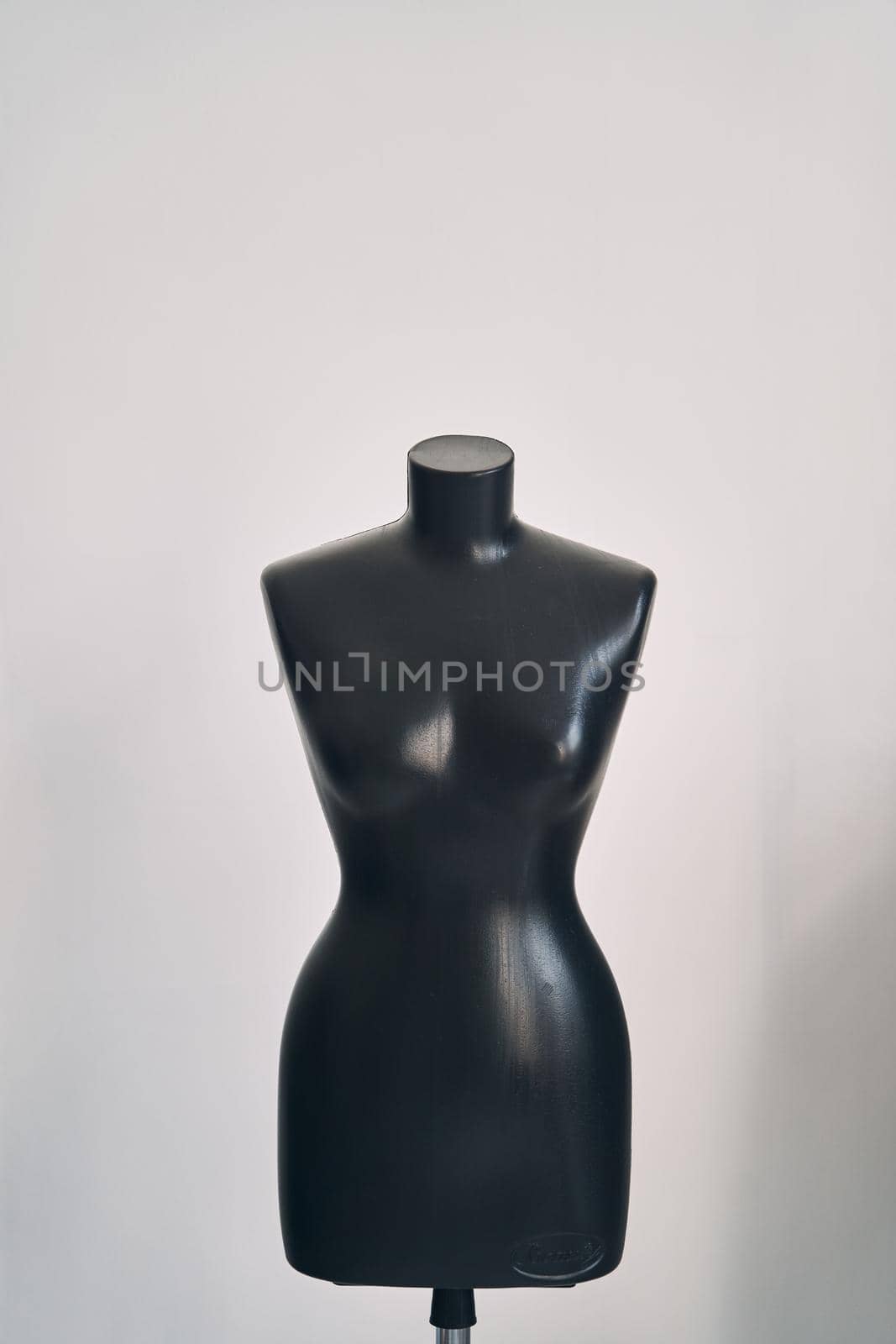 Black female mannequin for clothing on white background. High quality photo