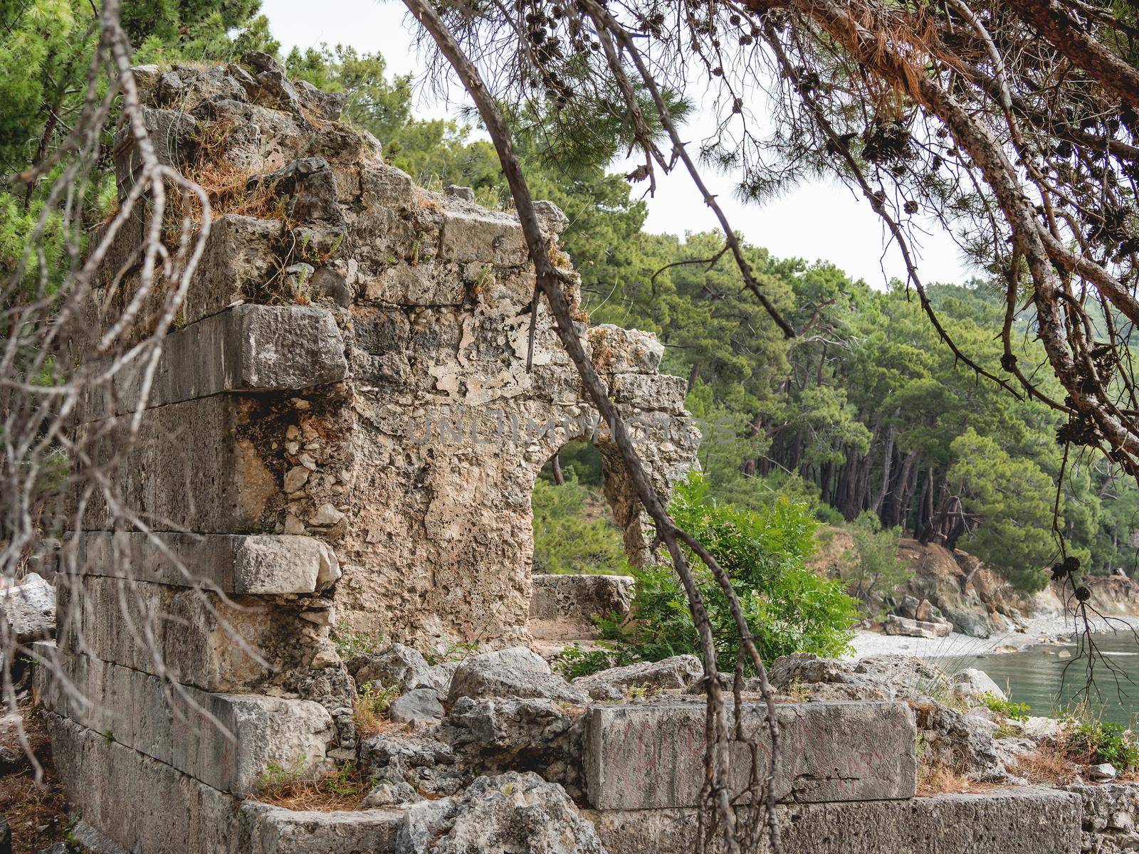 Northern Harbour of ancient city Phaselis. Ruins of Greek city on coast of ancient Lycia. Architectural landmark in Turkey. by aksenovko