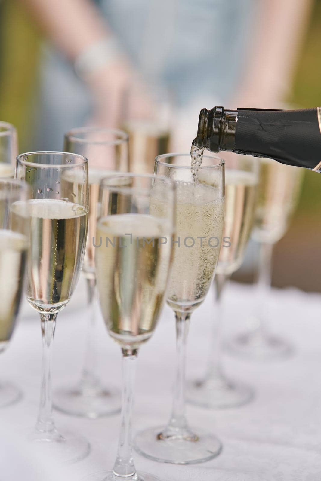 Glasses of champagne at the event. Champagne in glasses on a holiday close up by driver-s
