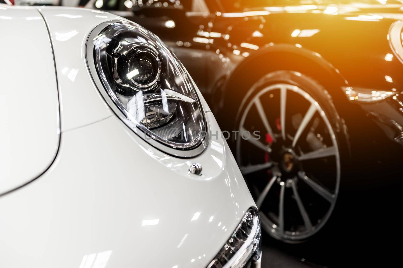 White and black cars in a showroom
