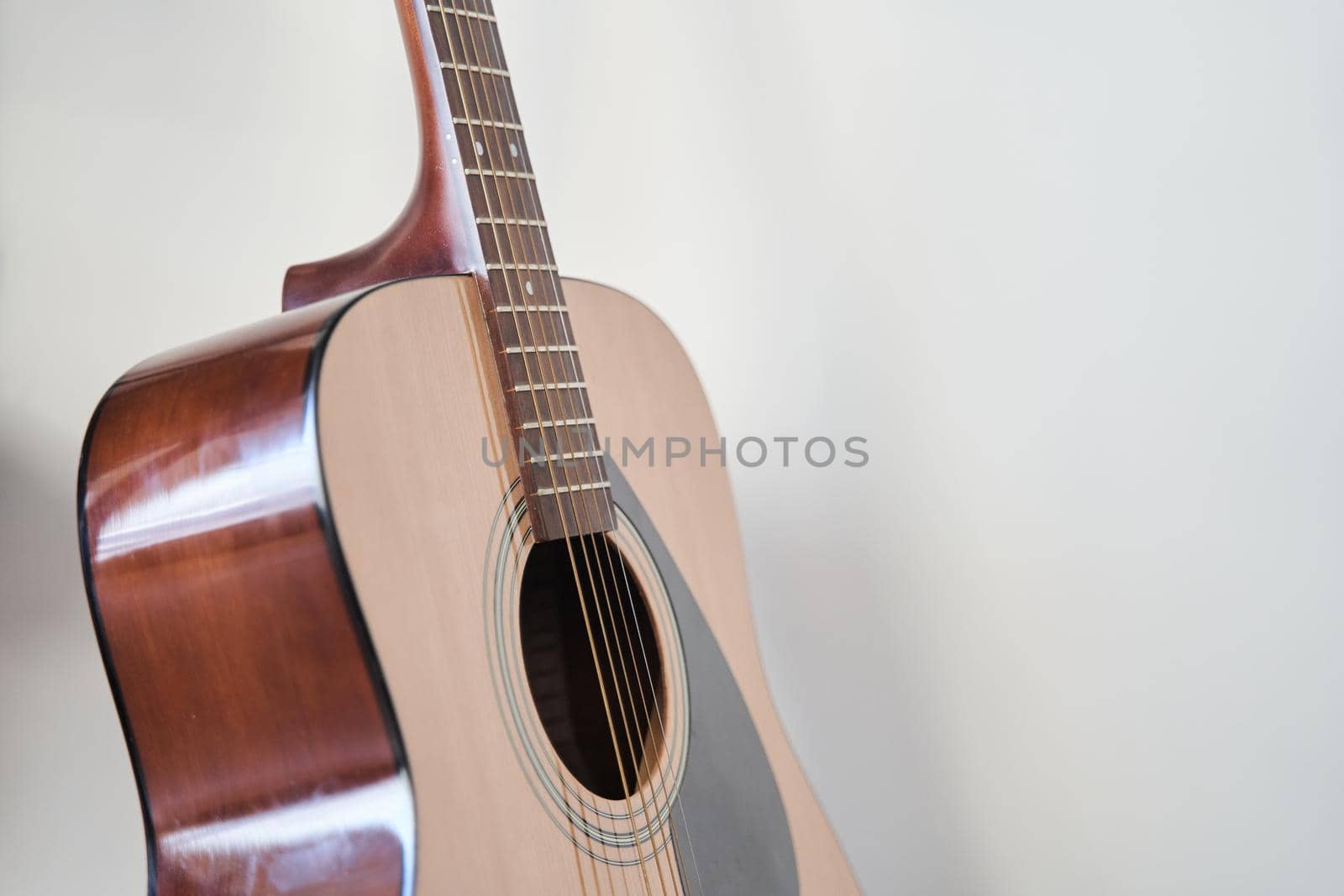 Soundboard of an acoustic guitar close up on a white background.