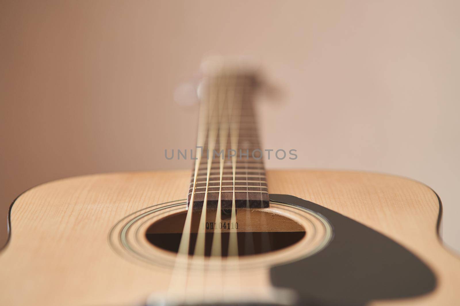 Acoustic guitar. Musical instrument. Close-up.