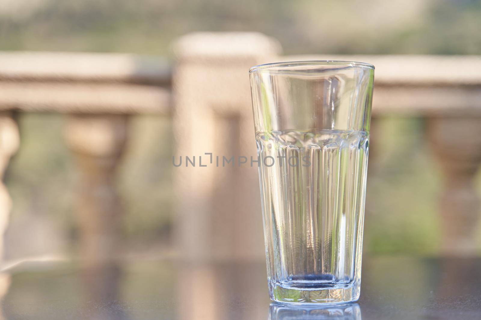 Empty transparent glass cup on table by driver-s