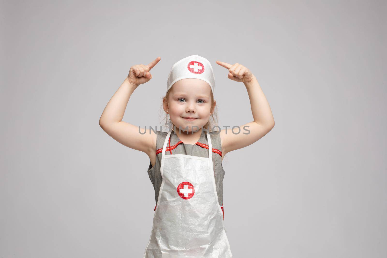 Adorable girl in doctor's uniform.She is a doctor. by StudioLucky