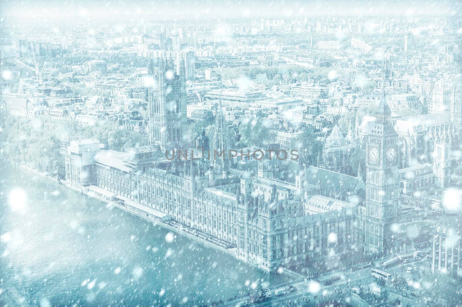 View of House of Parliament with Thames river in London with snow