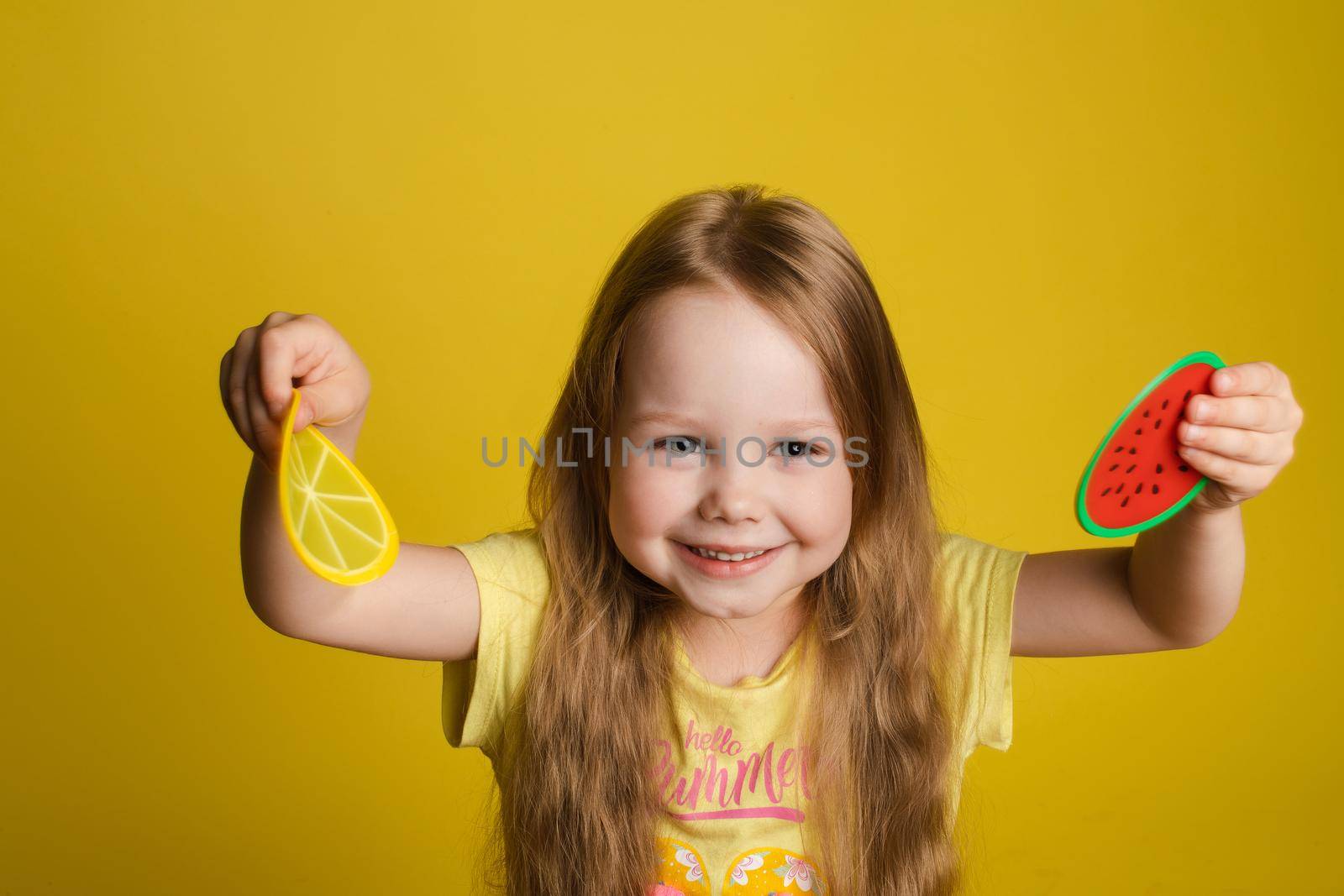 Ggirl standing on yellow background and closing eyes by StudioLucky