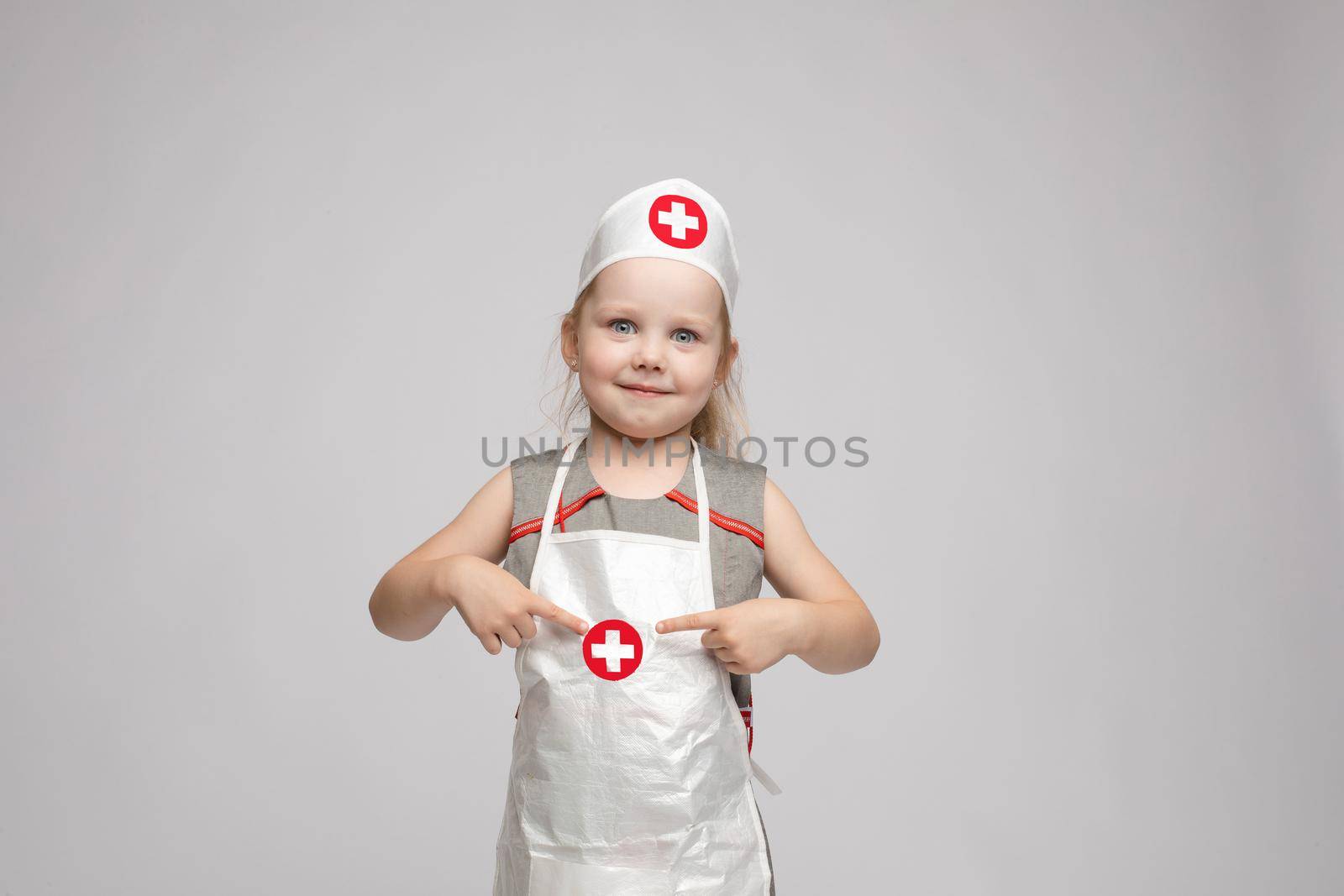 Adorable girl in doctor's uniform.She is a doctor. by StudioLucky