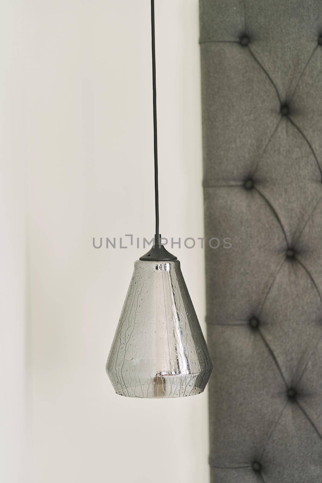 Gray Designer chandelier in the interior of the apartment. Close-up