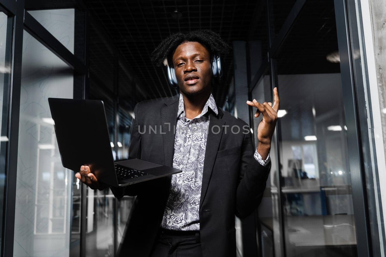 Black skin dj in headphones is listening music, making dj set and dancing. Party lifestyle