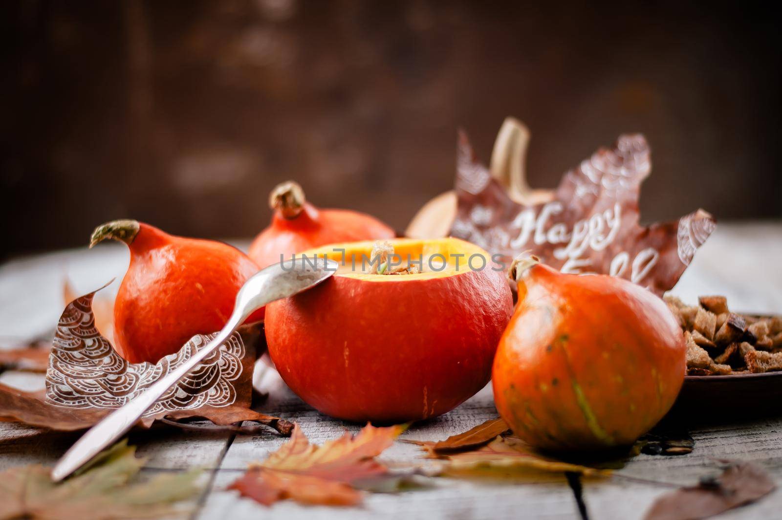 pumpkin cream soup in autumn scenery. High quality photo