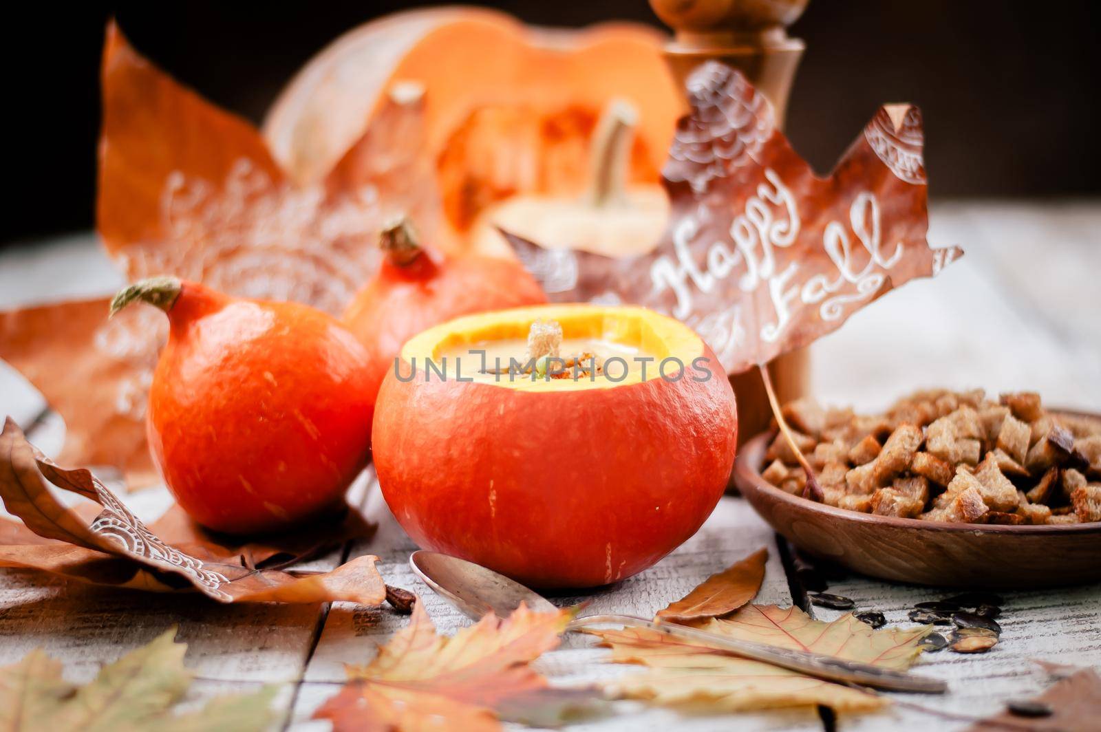 pumpkin cream soup in autumn scenery. High quality photo