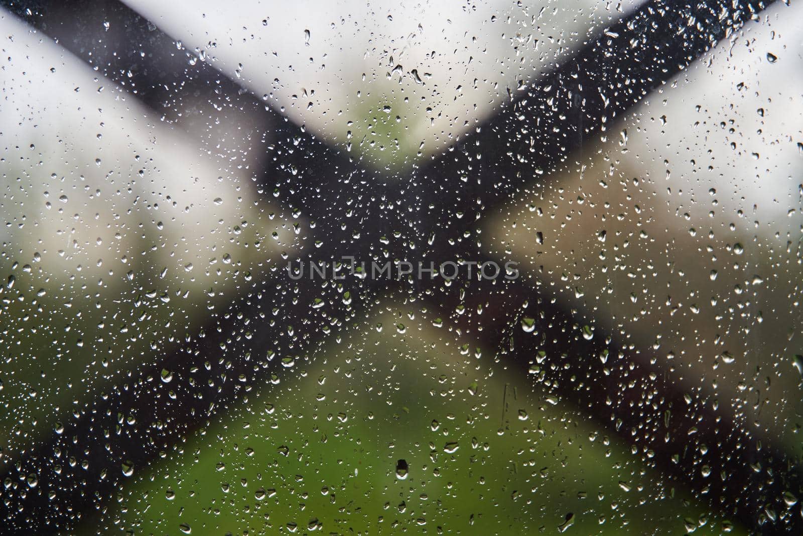 A lot of drops of water on the glass. Window glass with raindrops. by driver-s