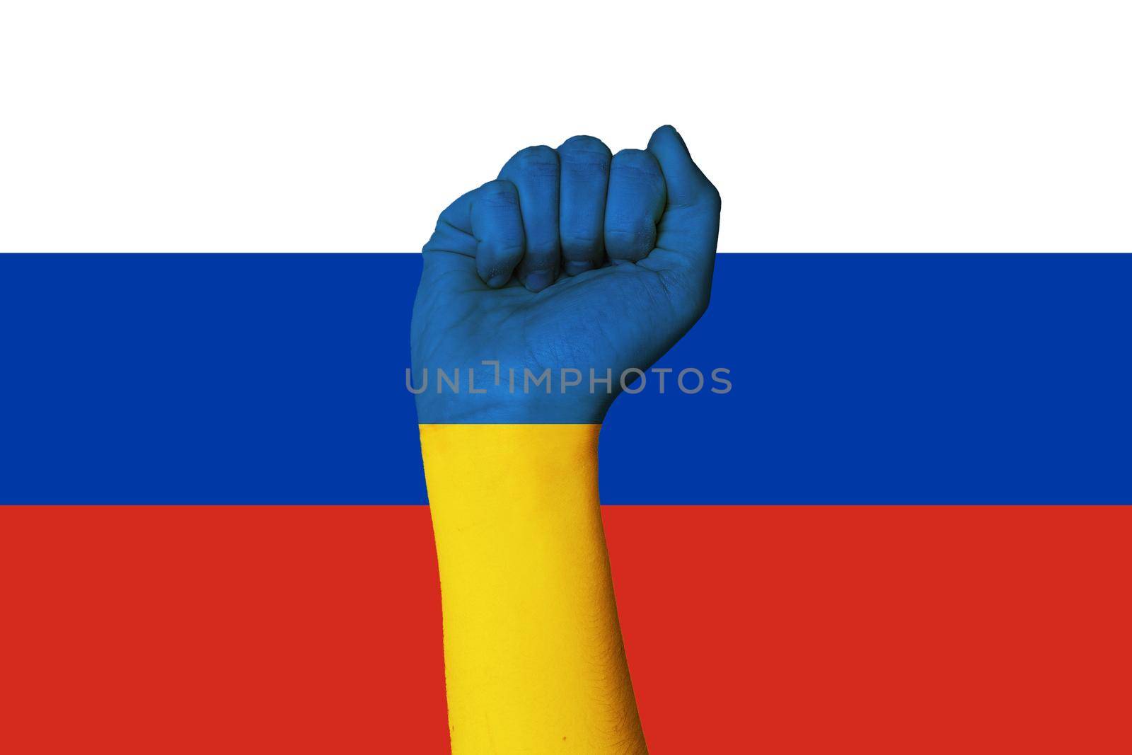 Fist of Ukrainian woman soldier on russian flag backround. Russia war against Ukraine. Putin invasion