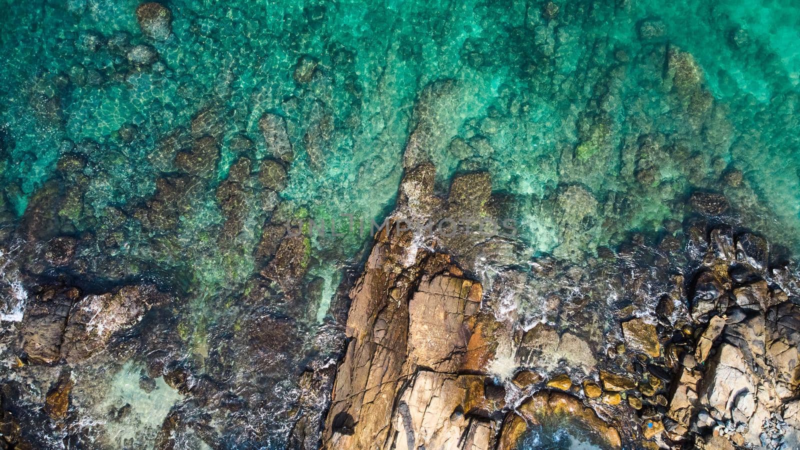 Aerial view of an emerald green sea and big foaming waves. Indian Ocean. Dikwella beach. Sri Lanka. High quality photo