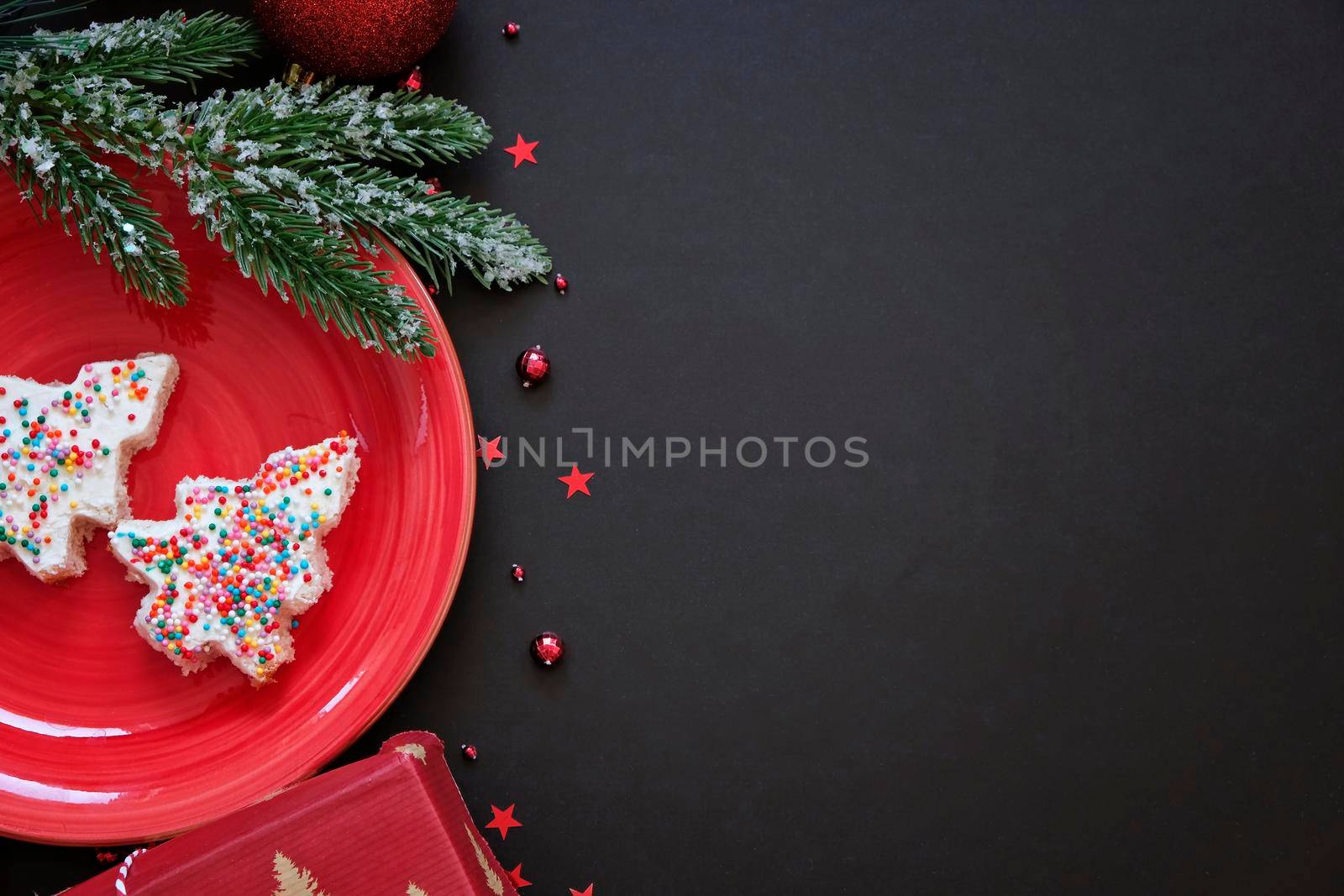 Christmas black background with edible christmas tree and space for text. New year food concept. by natus111