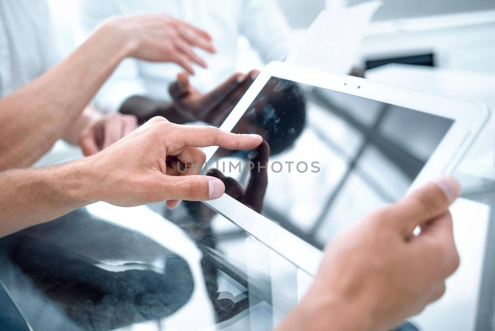 close up.businessman with digital tablet sitting at office Desk.people and technology .
