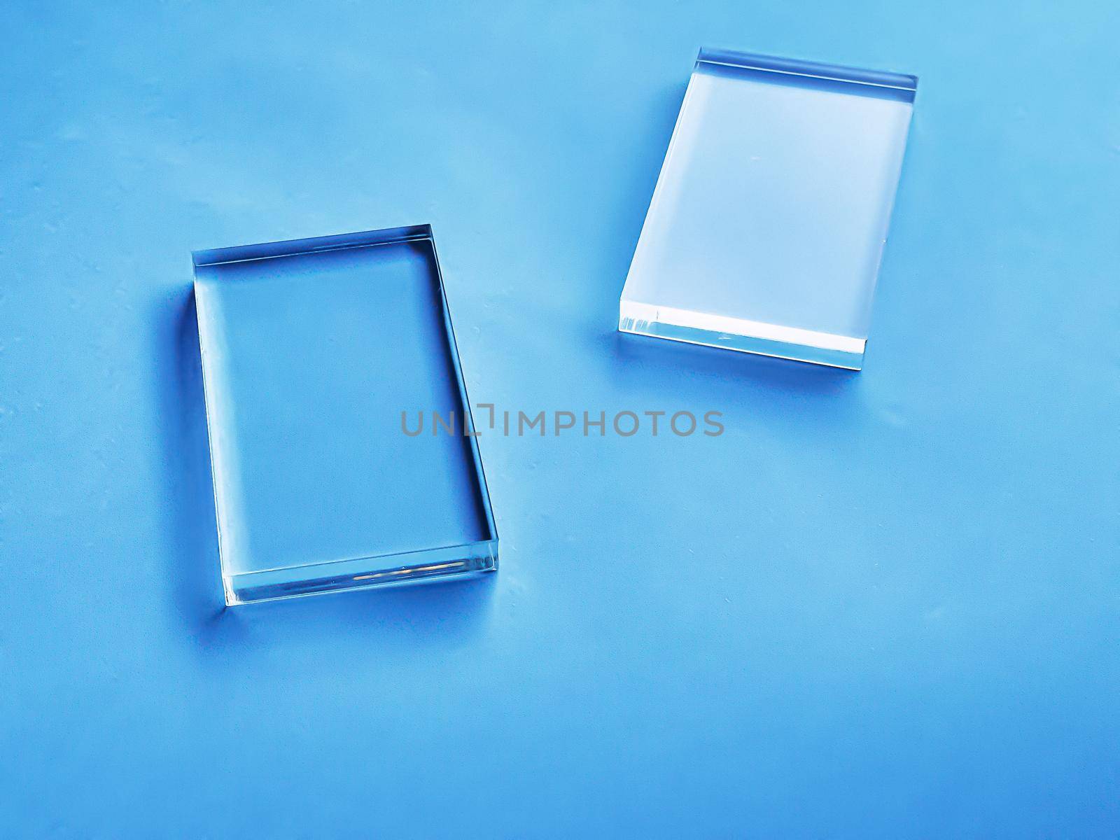 Glass device on blue background, future technology and abstract screen mockup design concept