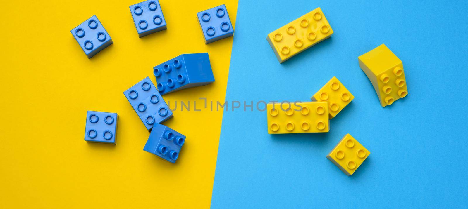 Plastic yellow-blue details of the children's designer. Children's educational game, top view