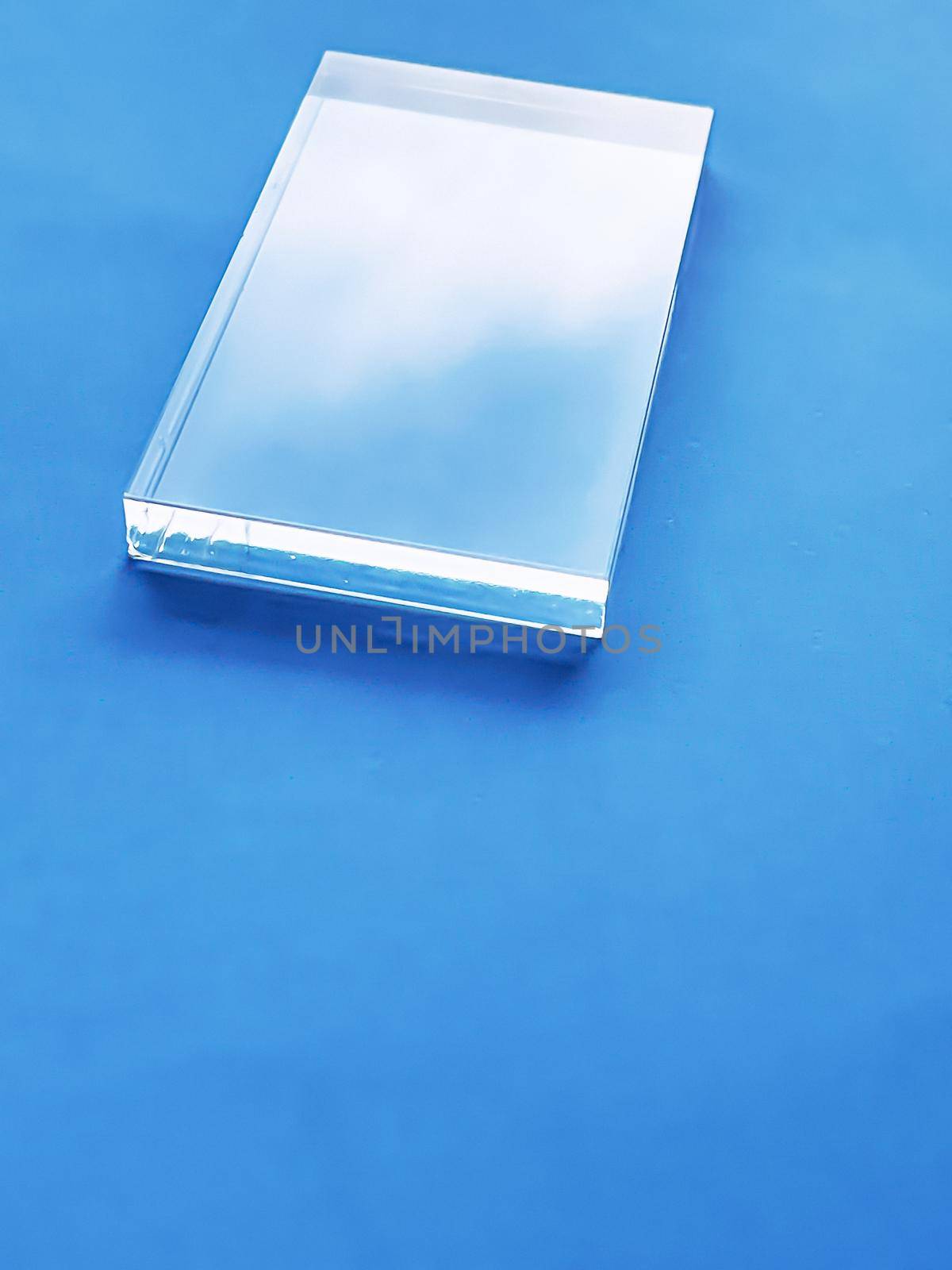 Glass device on blue background, future technology and abstract screen mockup design by Anneleven