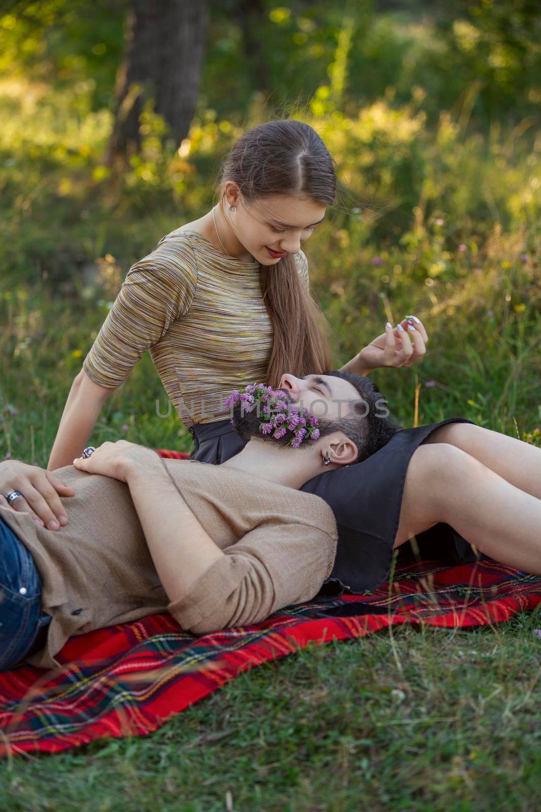 man with flowers in his beard