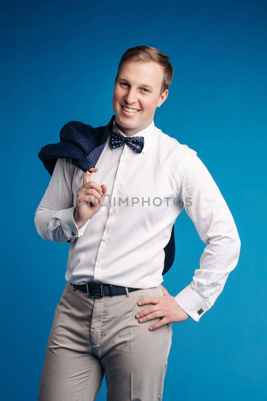 Portrait of handsome man in black suit by StudioLucky