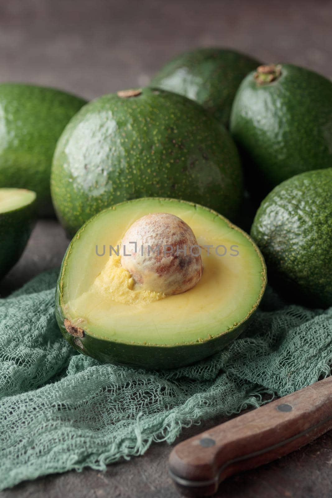 Ripe Green Avocado on a dark background