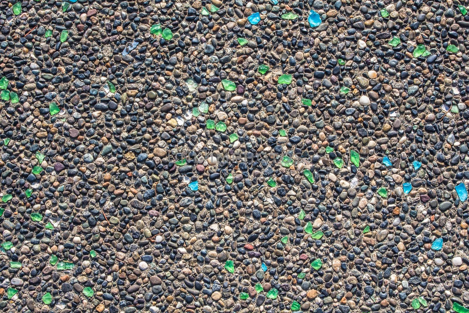 texture of concrete wall covered with shards of multicolored bottle glass by JuliaDorian