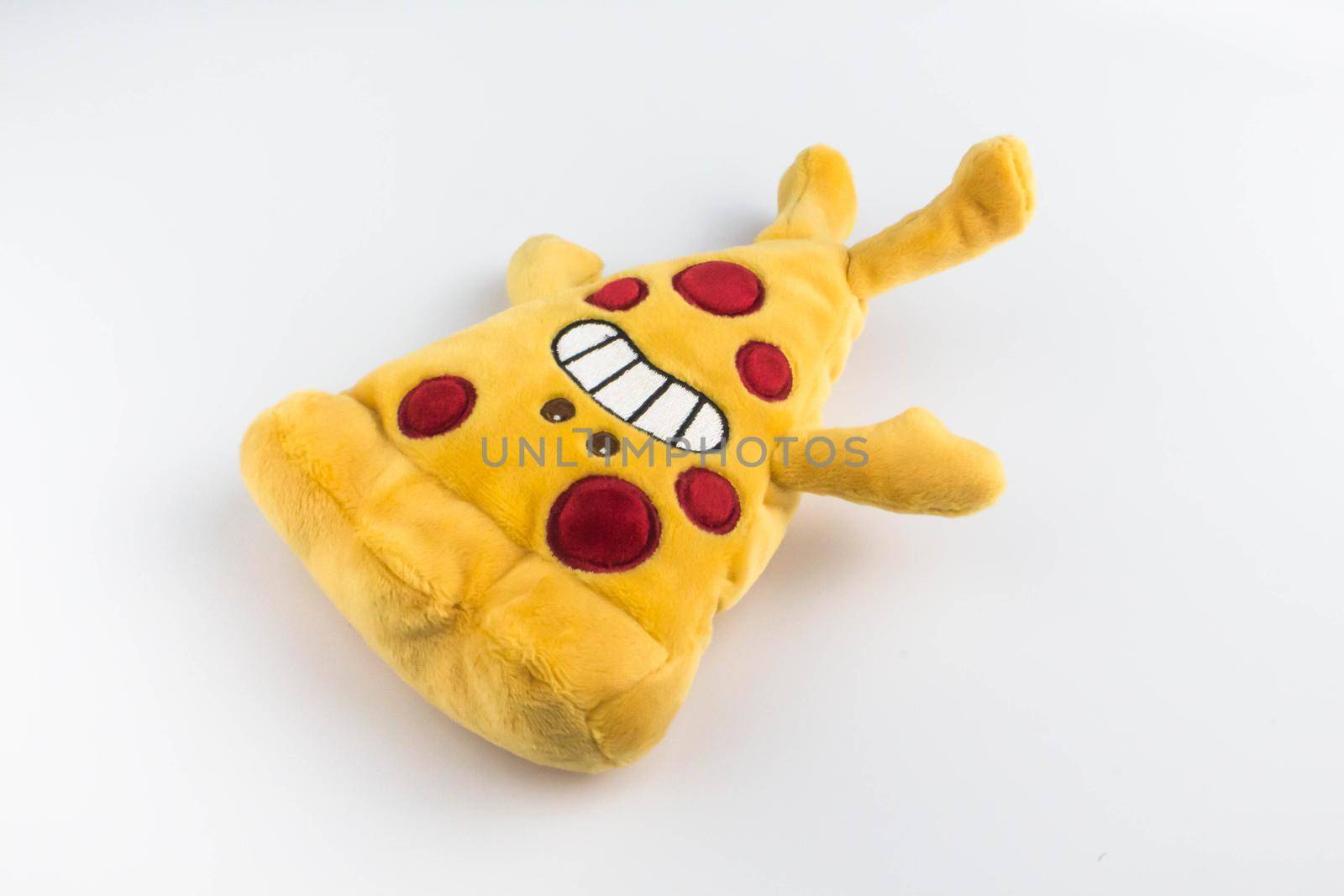 Colorful plush pizza piece on isolated white background