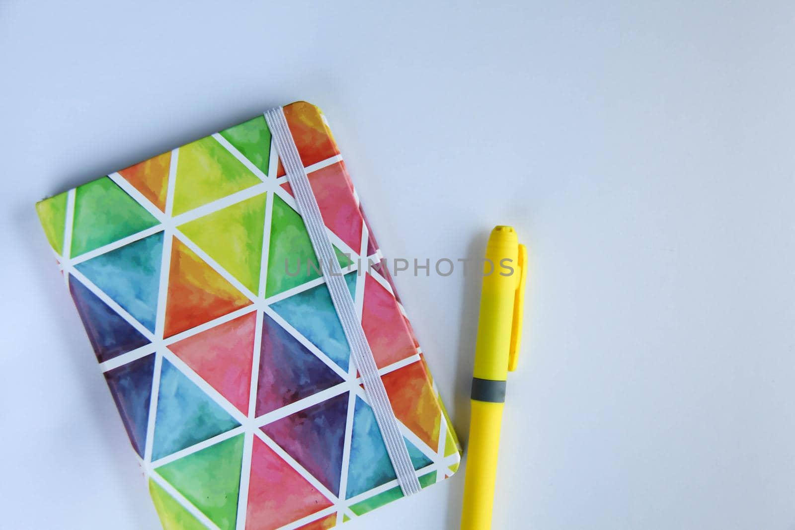 Back to school concept, school supplies, top view of colorful pastel notebooks and pencils on white background banner by JuliaDorian