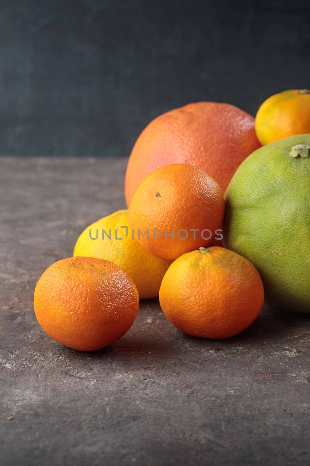 Fresh ripe citrus geen orange on a dark background