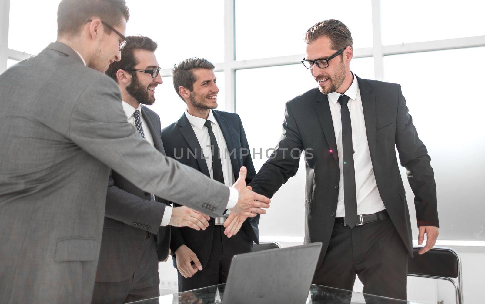 boss and employee shaking hands with each other by asdf