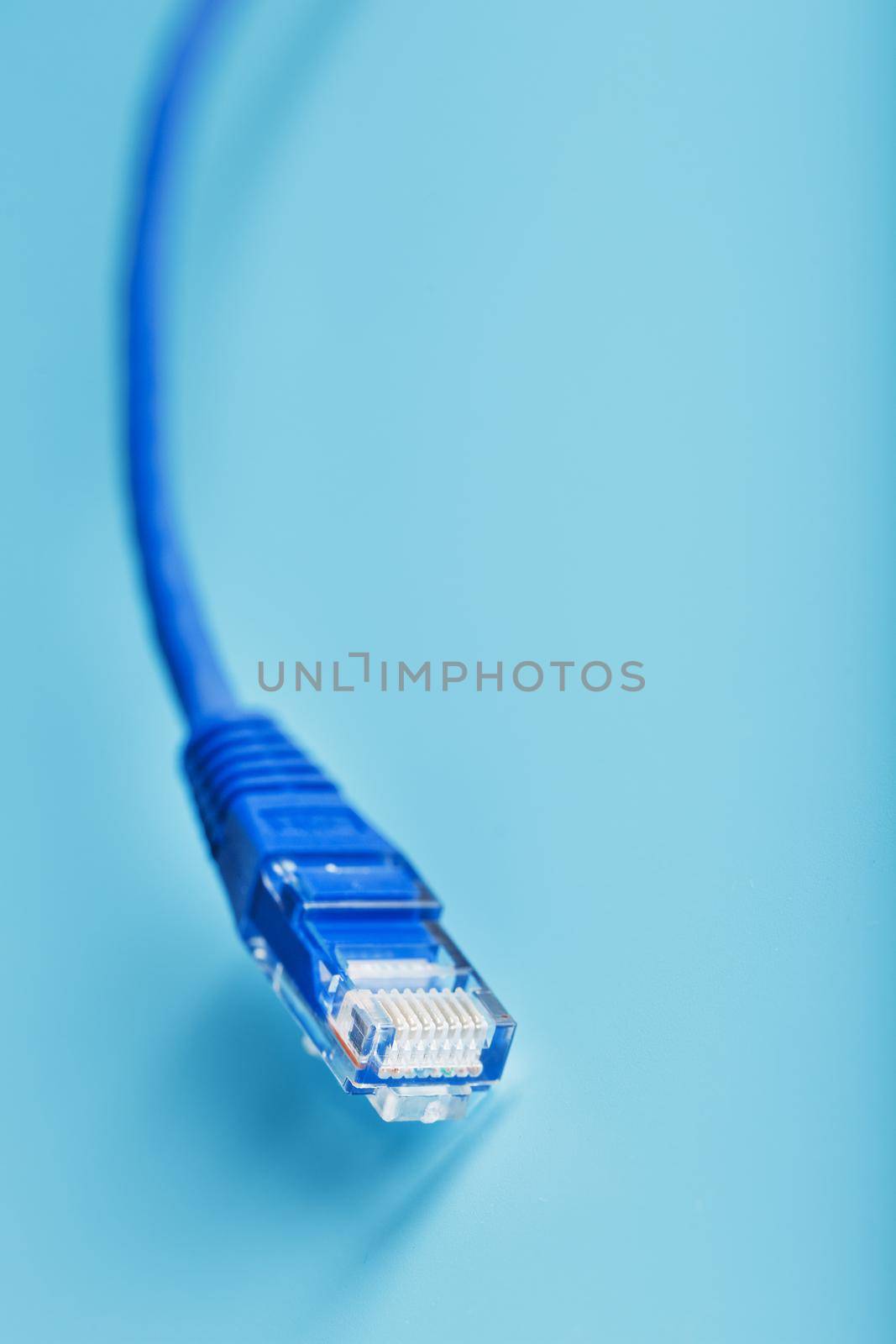 Blue UTP Internet Cable - Isolated on a blue background Ethernet Cord