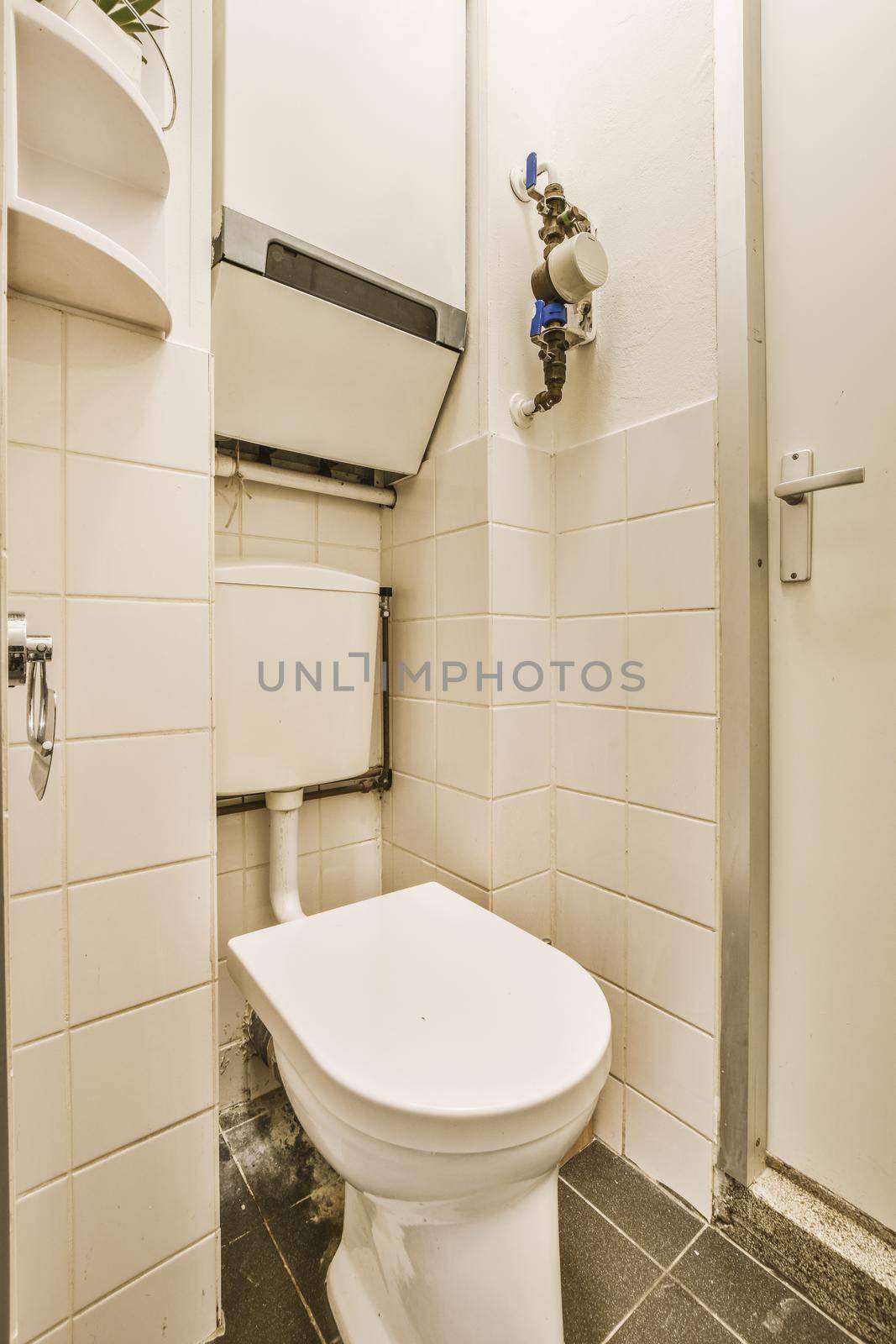 View of a small bathroom in a cozy house with a toilet