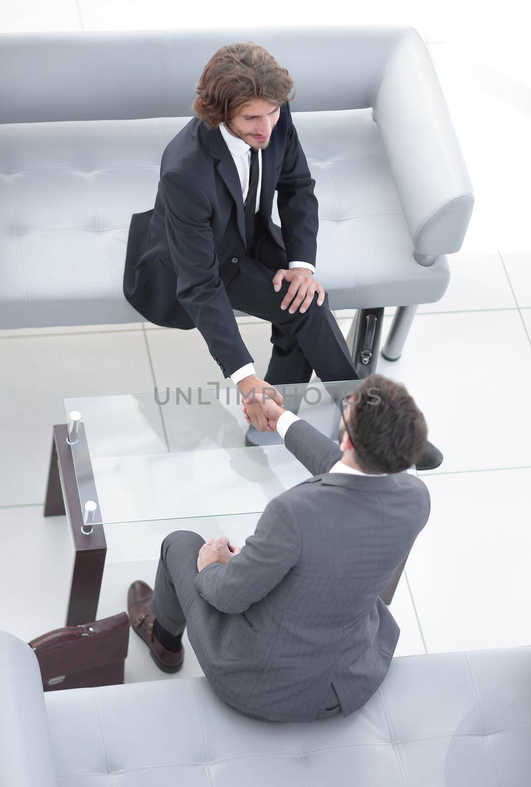 view from the top. handshake lawyer and businessman