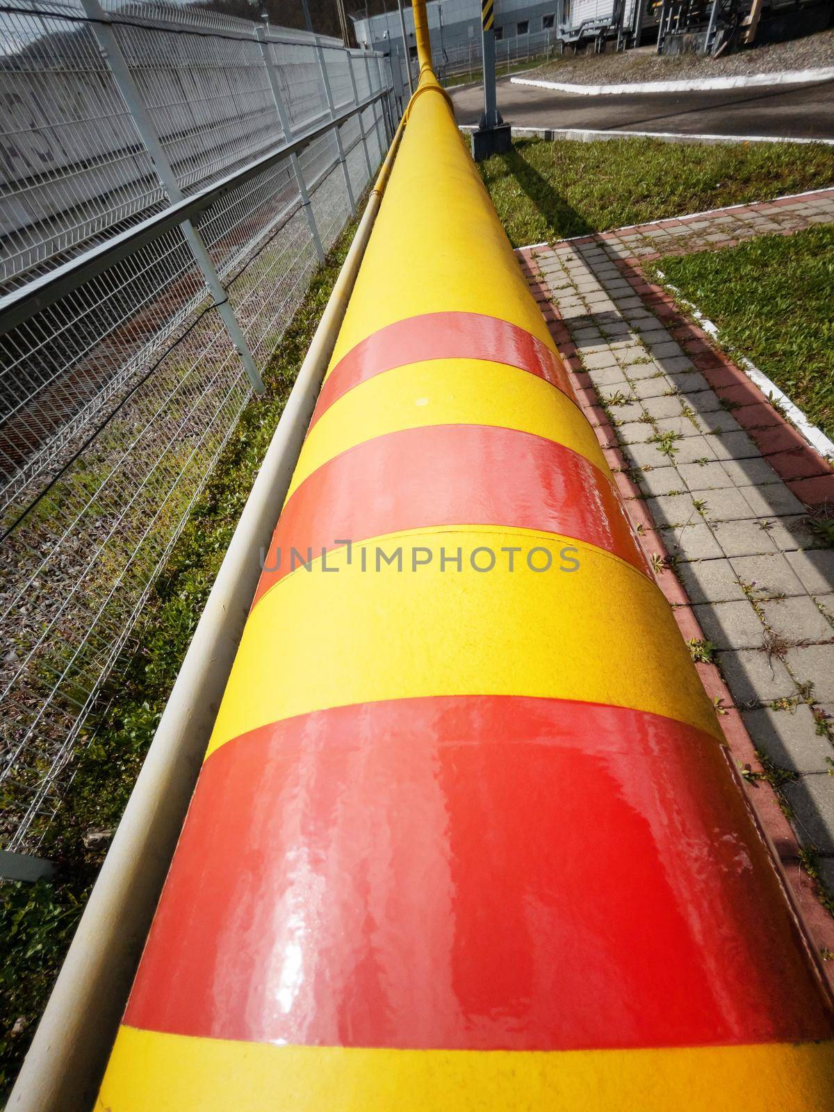 Yellow-red main line of the natural gas supply pipeline to the consumer for the generation of thermal energy