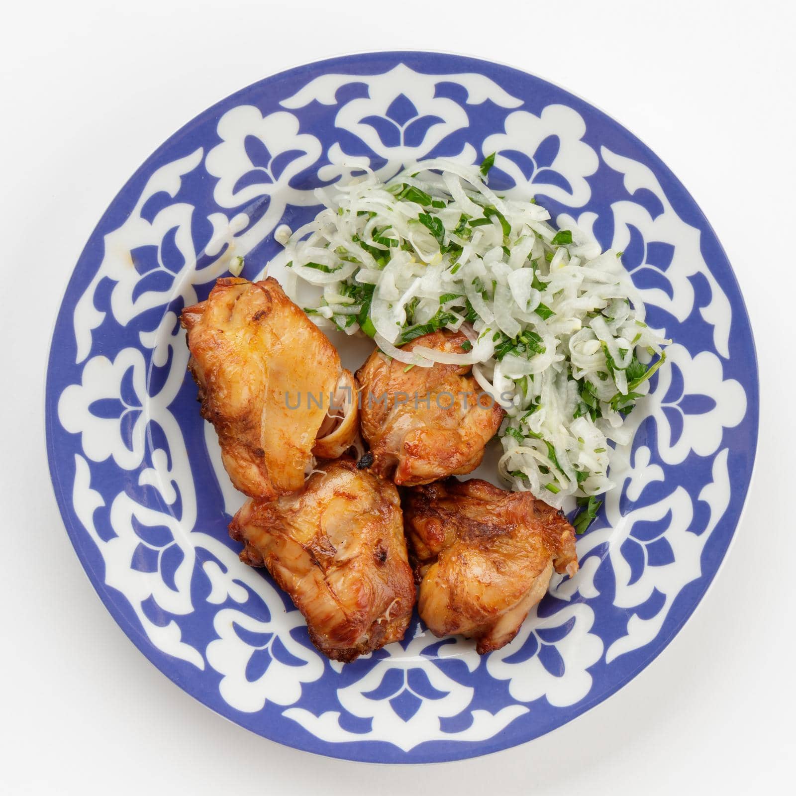 Oriental Uzbek cuisine dish in traditional plate