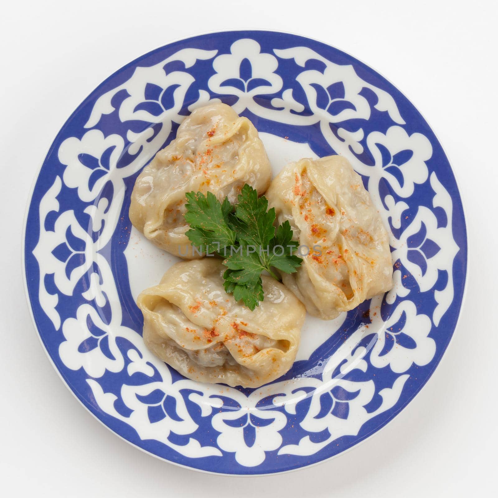 Oriental Uzbek cuisine dish in traditional plate