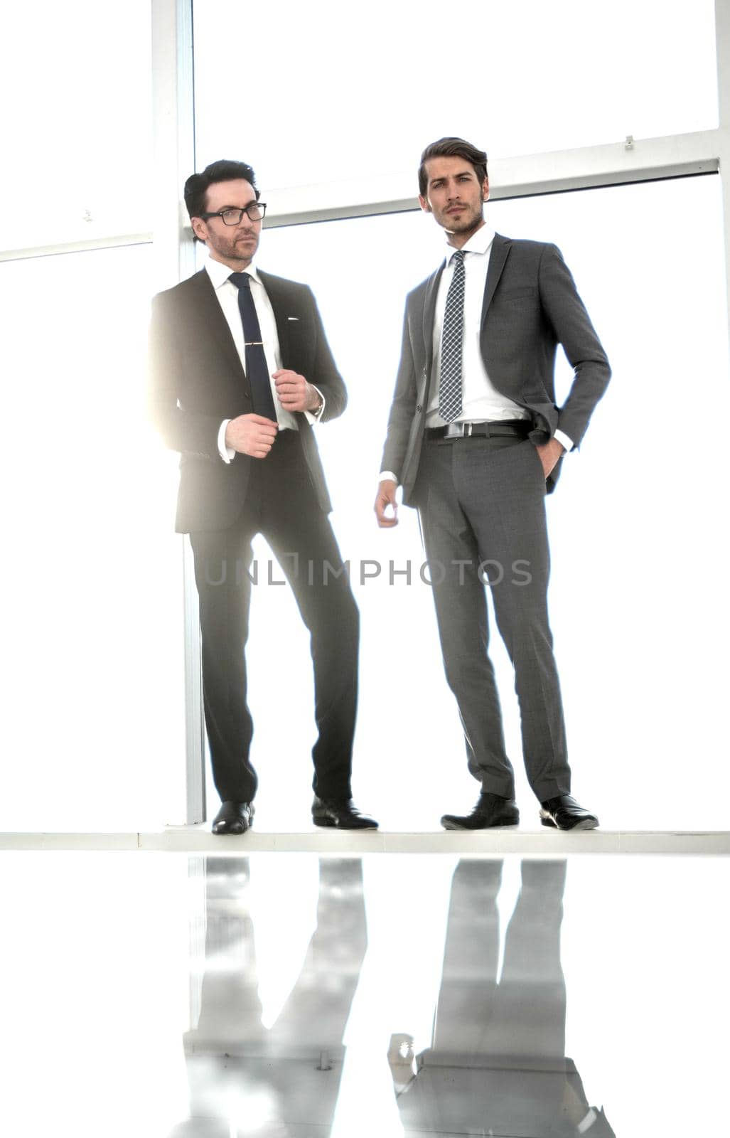 background image.two businessmen looking at copy space. business concept