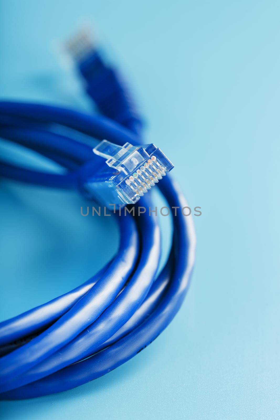 Blue UTP Internet Cable - Isolated on a blue background Ethernet Cord