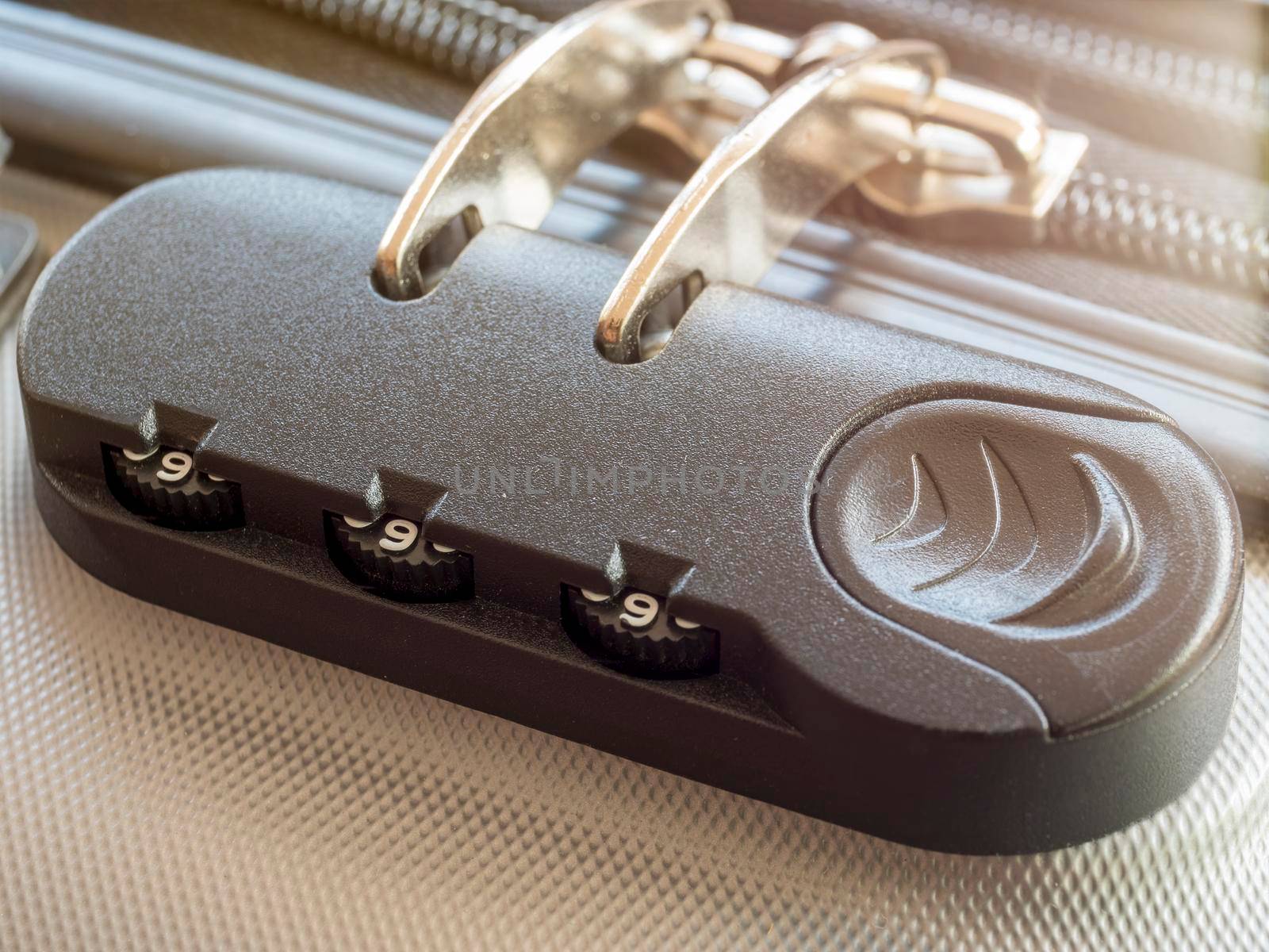 Close up travel bag with zipping number code locked. close-up of silver suitcase number code lock. Summer holiday travel concept.