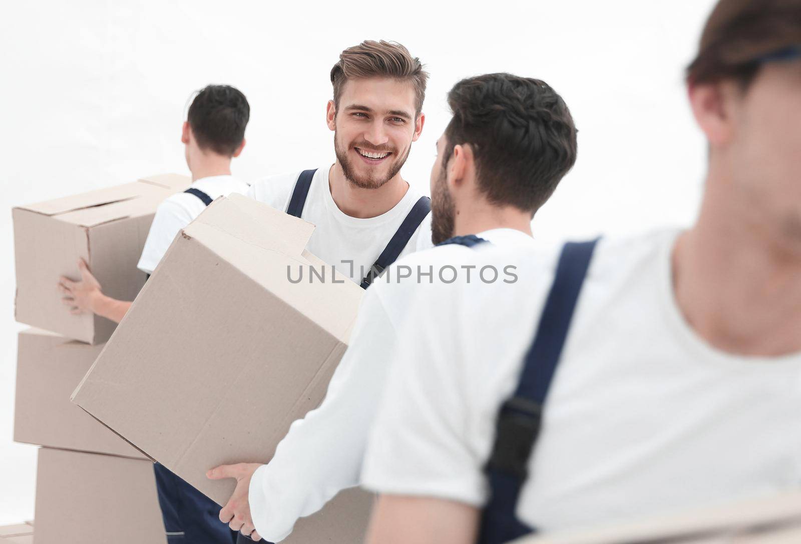 Photo workers pass each other boxes when moving flats. by asdf