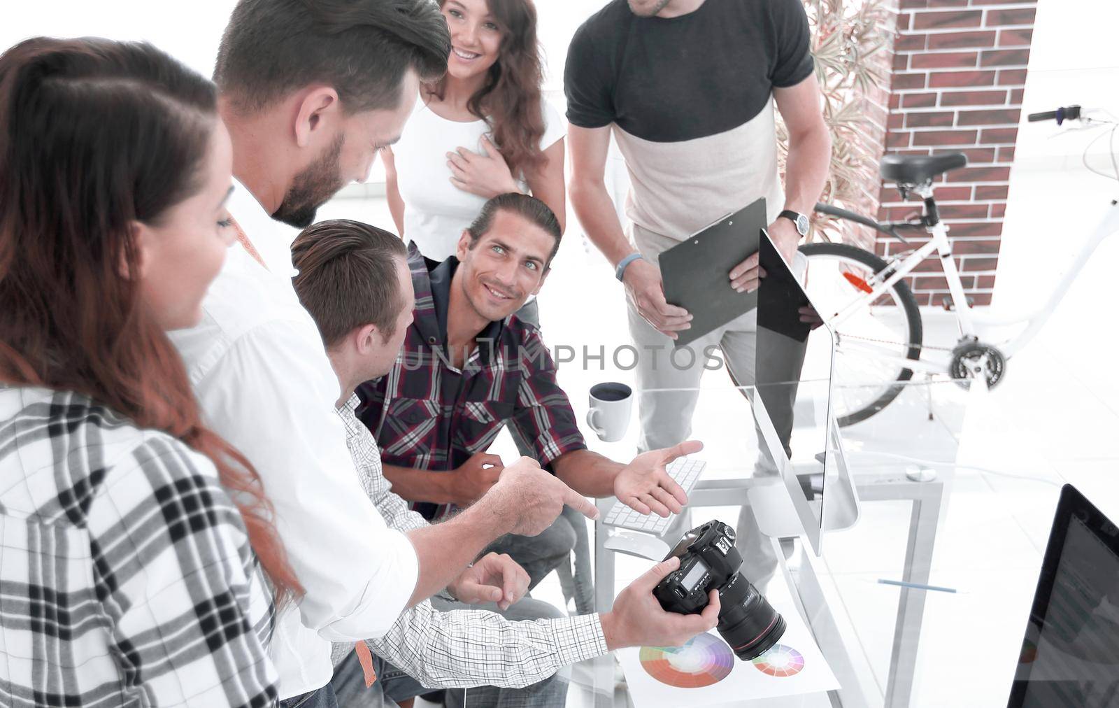creative team discussing new ideas sitting at your Desk