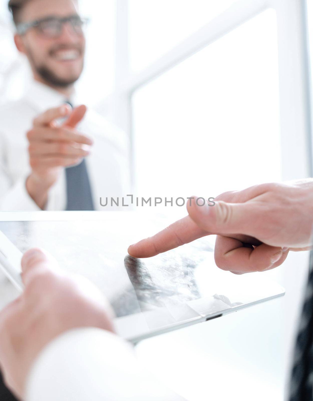 close up.businessman with digital tablet on office background.business and technology